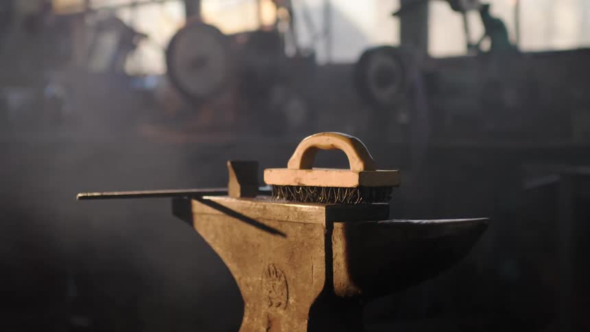 A brush sits on an anvil