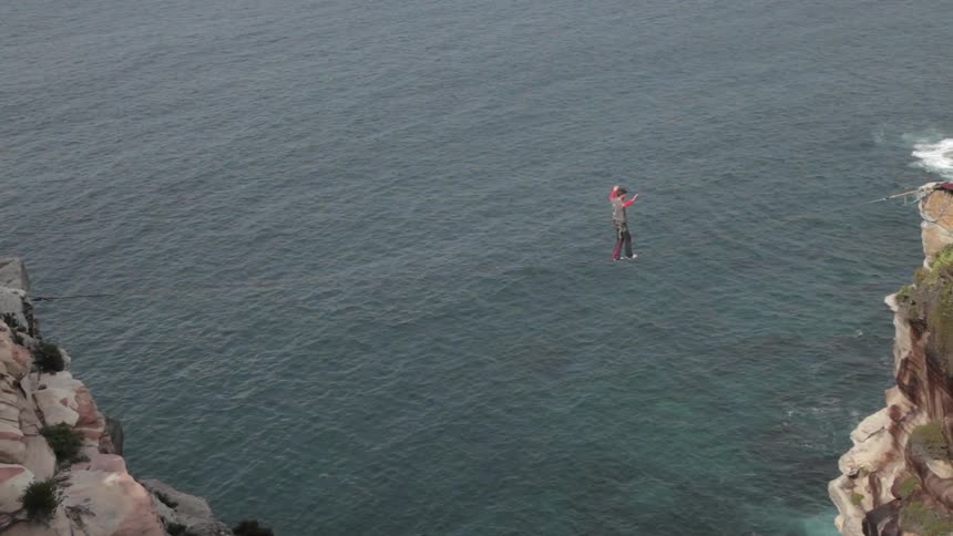 A person tightrope walking