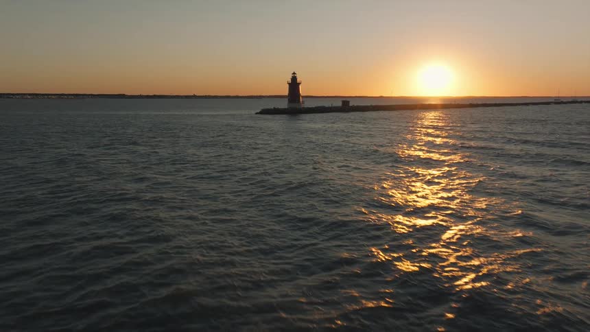 A lighthouse at sunset