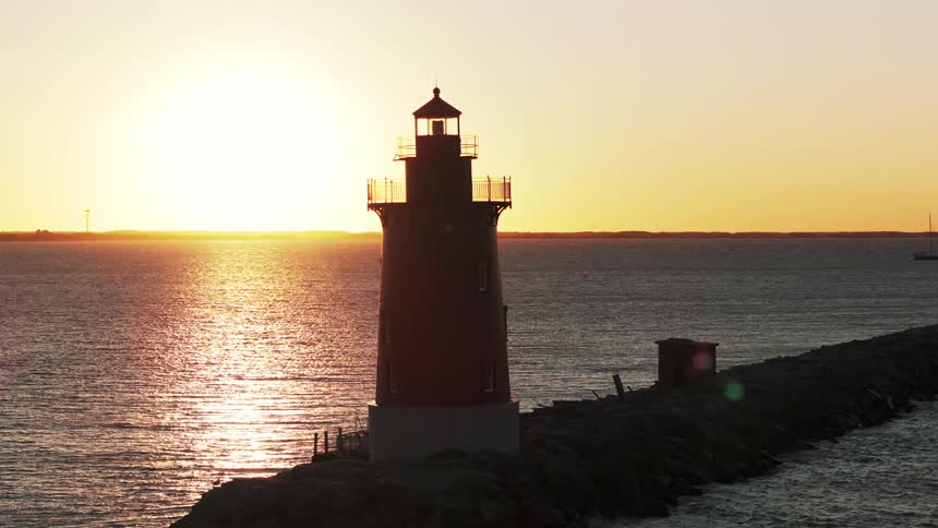 A lighthouse at sunset
