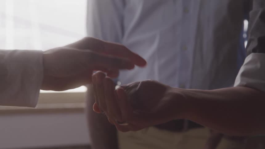A worker is handed a key in the office