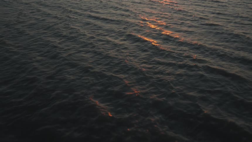 Sunlight is reflected over the ocean