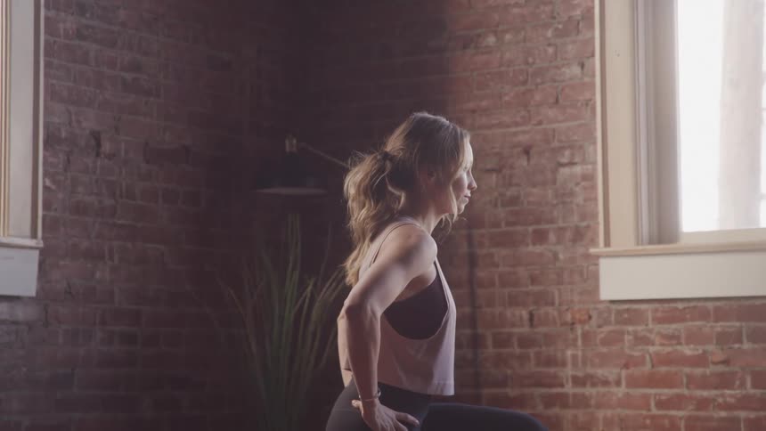 Girl doing pilates exercises at home