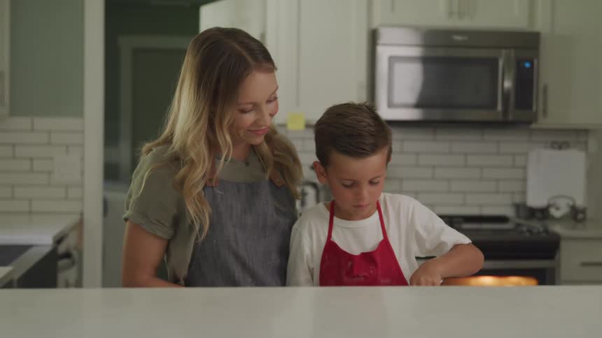 Son and mother cooking happily