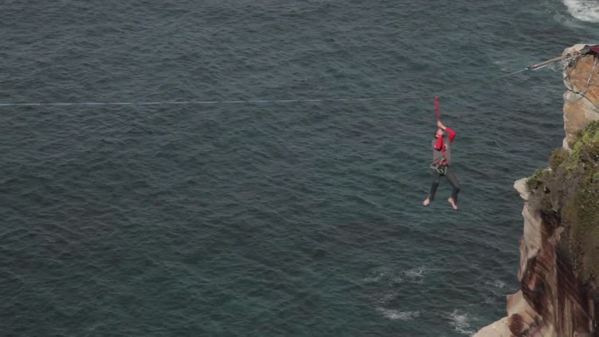 A person tightrope walking