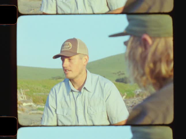 Guys with hats talking to each other