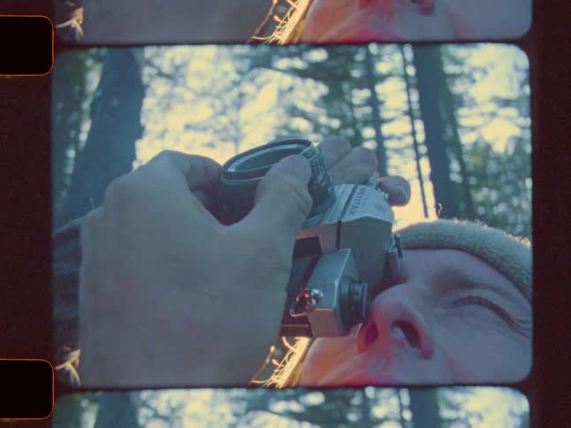 Man zooming in and taking photos of nature