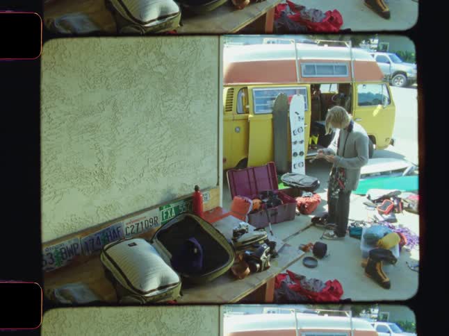 A footage of a person arranging properties into a bus