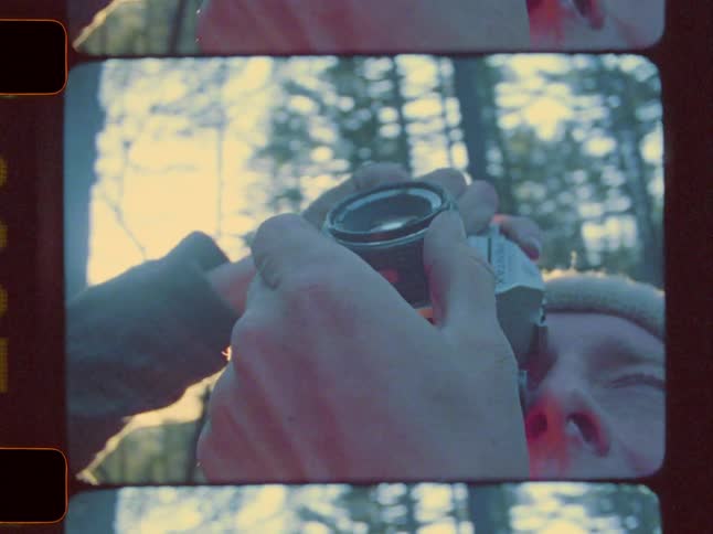 A man is photographing the forest
