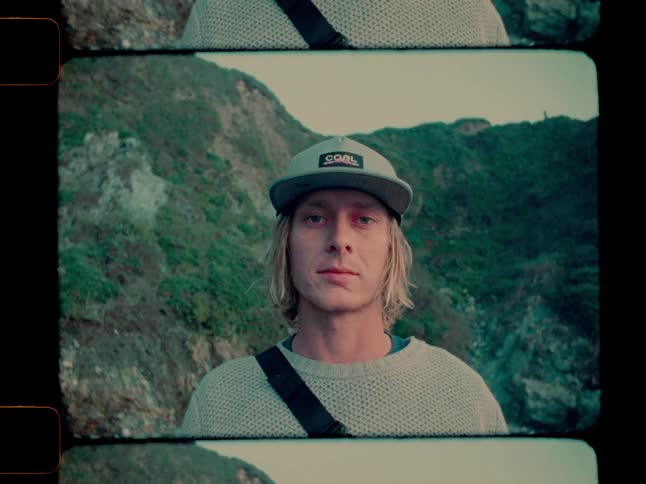 Man looking around then looking toward the camera