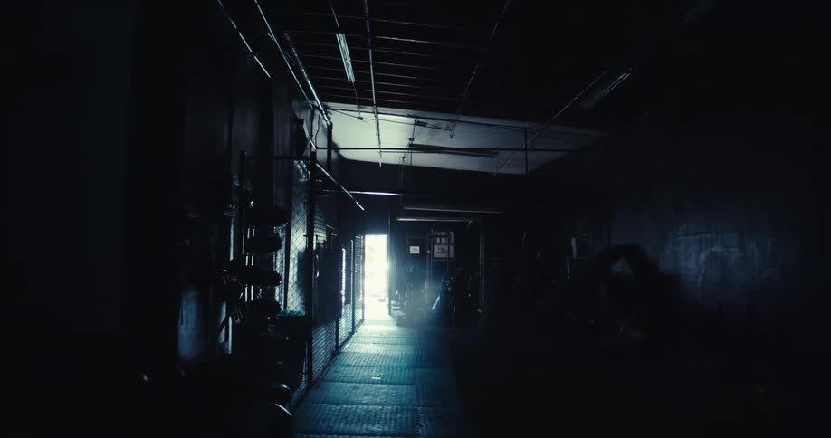 Light shines into the dark hallway