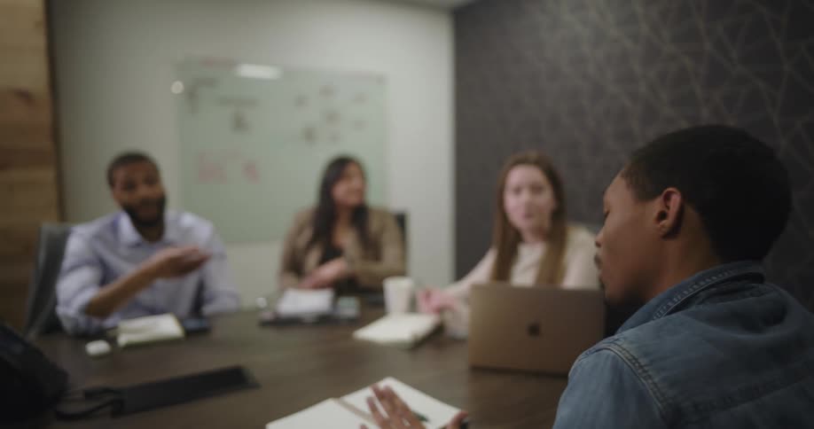 A man is giving a lecture in the conference room