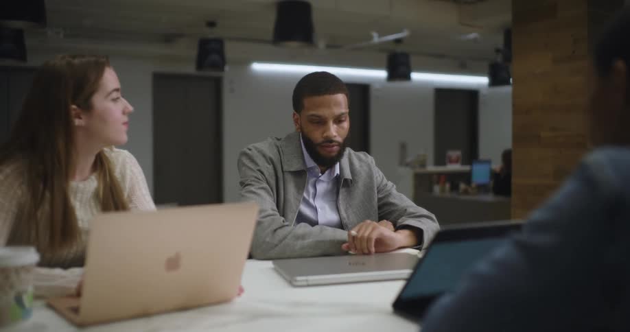 Guys talking in an office