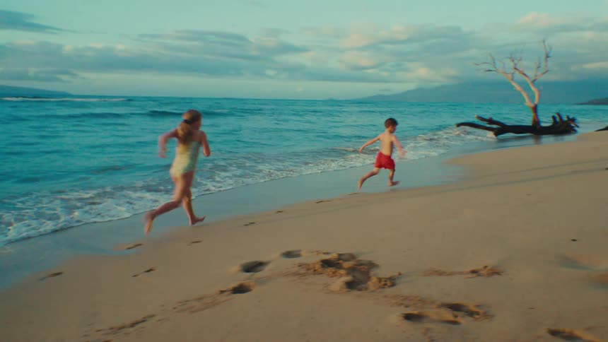Children playing by the sea