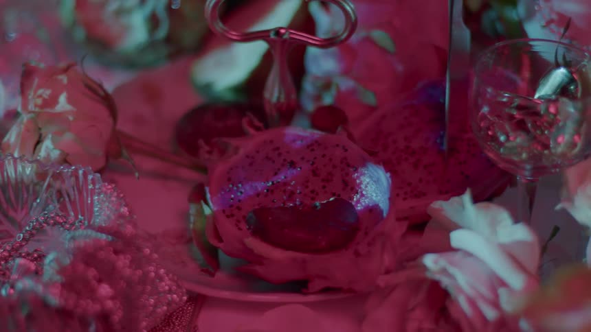 A table is decorated with crystal glasses and flowers