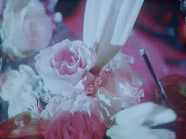 Sunlight reflects off a floral table arrangement
