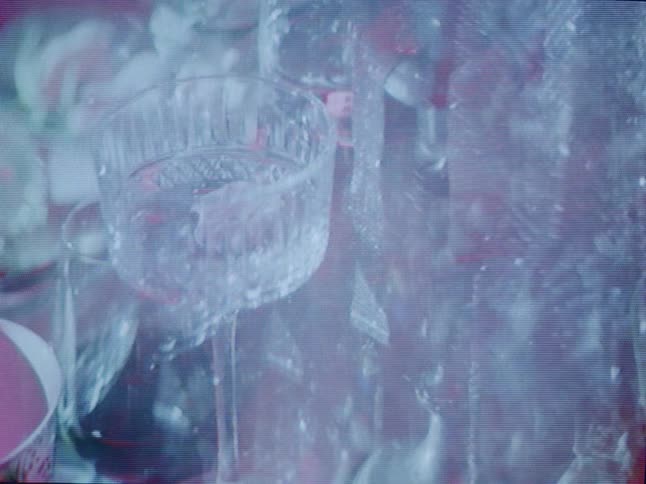 A crystal glass shows through layers of glass