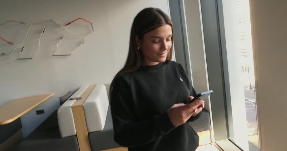 A footage of a lady texting on a smartphone