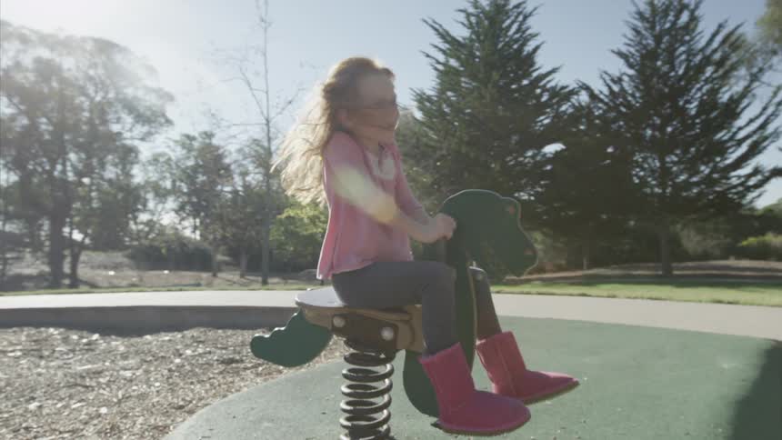 A girl playing in a park