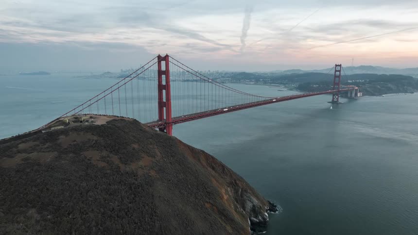 View of a large bridge in the mountains in the middle of the sea