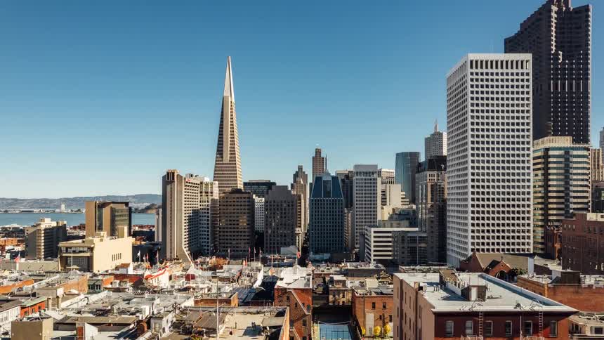 View from an urban basketball court and then over the whole city