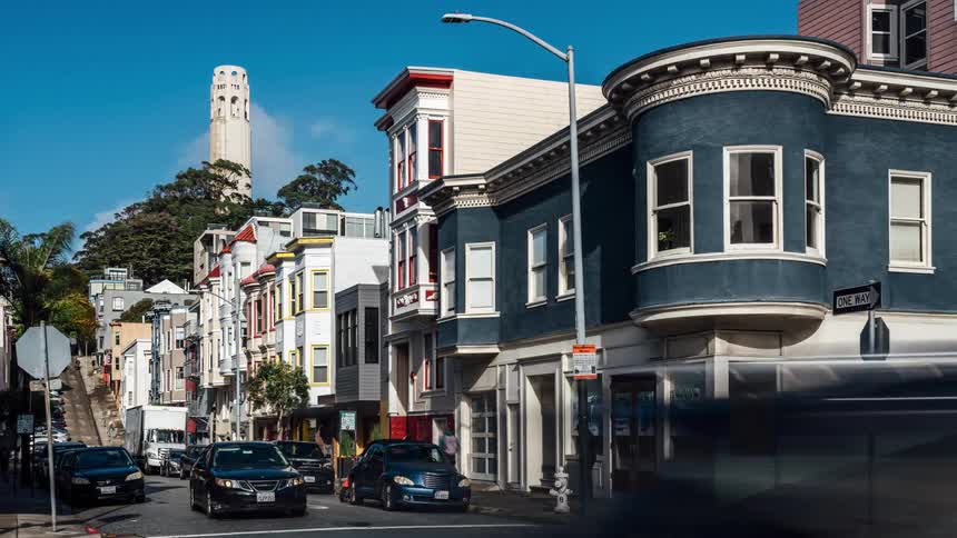 Downtown of everyday life in a historical city is shown through a time lapse of cars and people