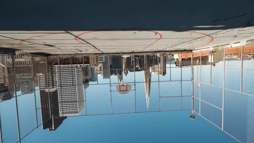 View of a basketball court in the middle of the buildings