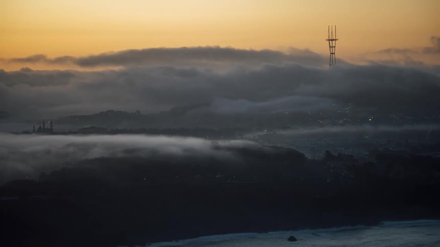 View of a city and sea with lots of fog
