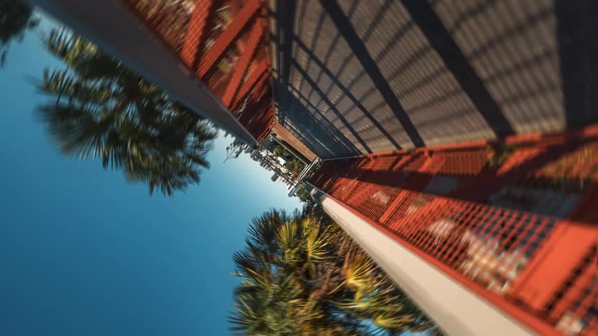 View inside a small metal bridge overlooking a park