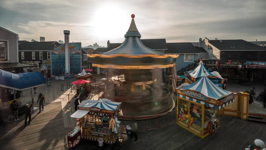 People move around the grounds of a carnival