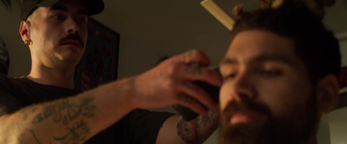 Boy whose hair is cut with a razor