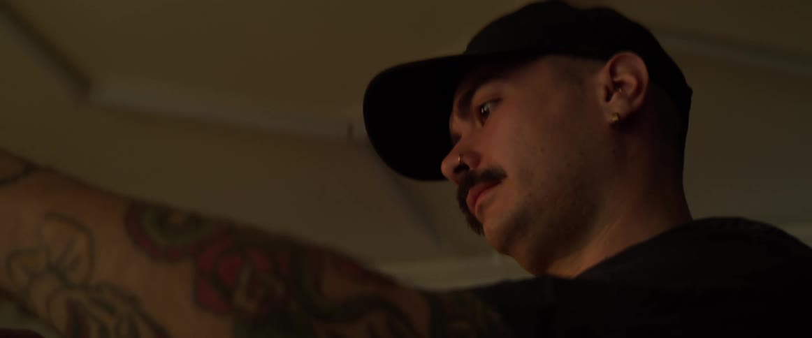 A man is reaching his hands forward