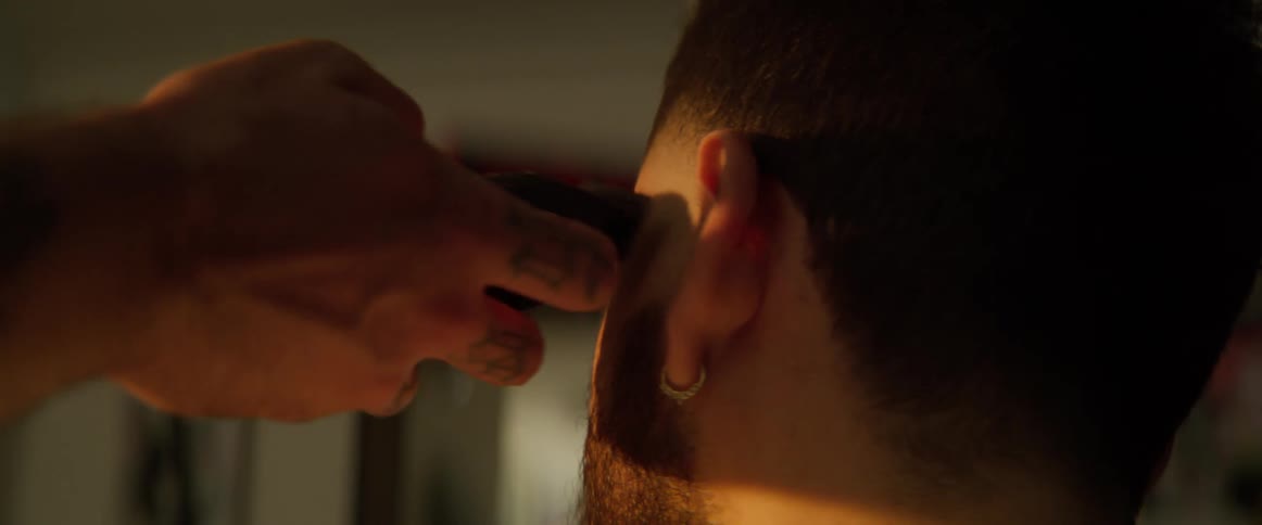 Boy whose hair is cut with a razor