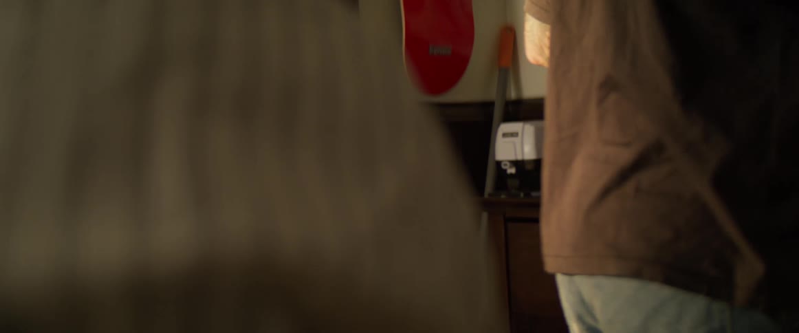 Boy picking up a razor and approaching a customer
