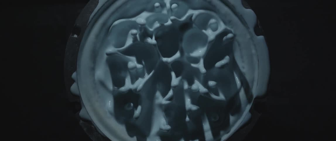 Blue paint bounces and vibrates