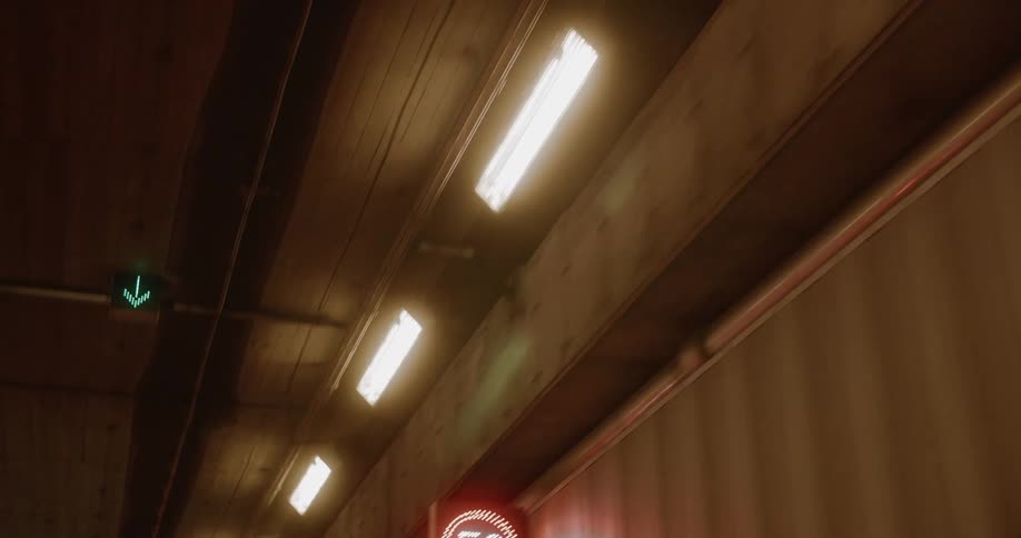 Road along a tunnel with traffic signals
