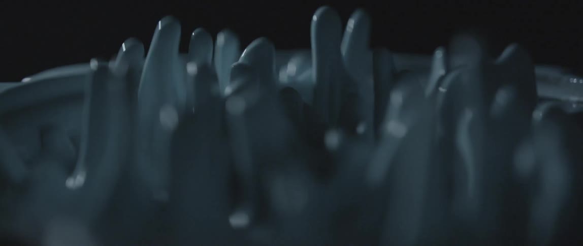 White liquid spiking up and down rhythmically