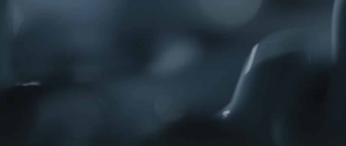 A milky, gray liquid is bouncing up and down