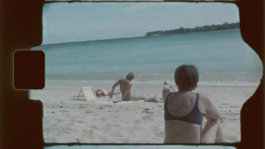 A family of four enjoying the sun at the beach