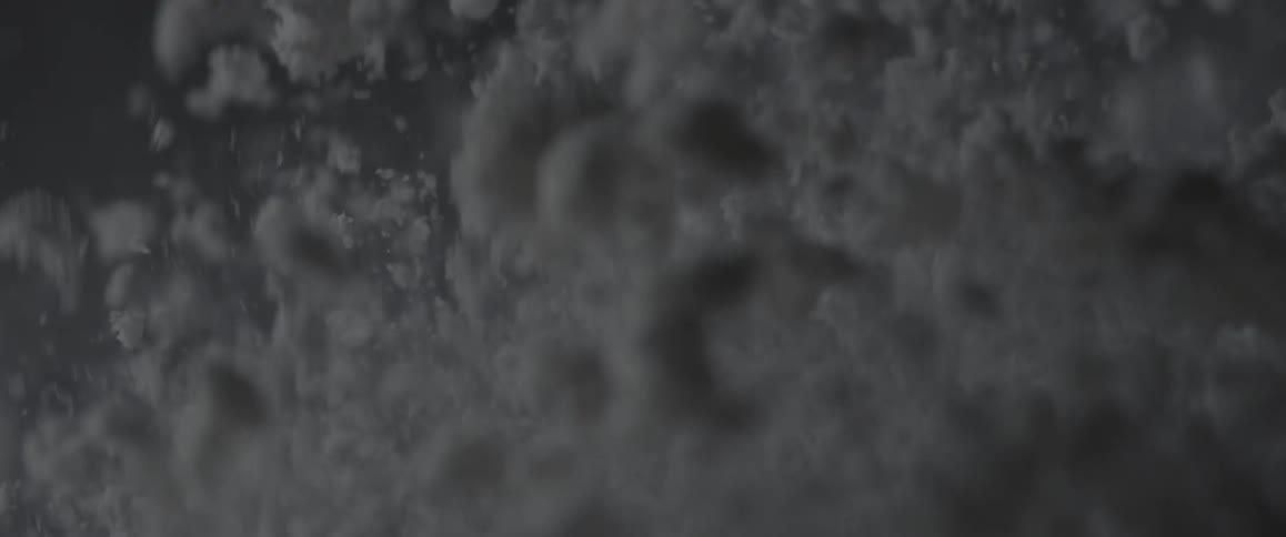 Particles of sand vibrate and bounce into the air