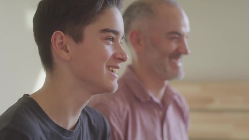 A father and son are laughing
