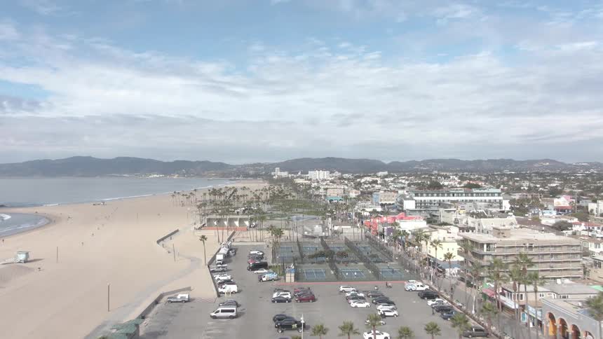A city on at the edge of the beach on a sunny day