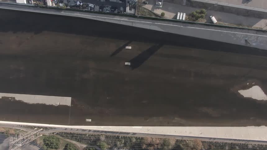 Overhead view of a large area of the city perhaps the bed of a river without water