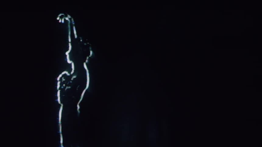 A dancing figure is on the hologram