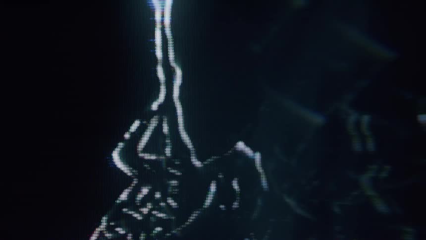 Silhouetted woman made of lines dances in the dark