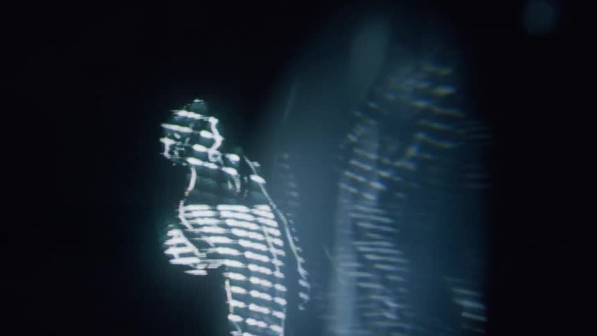 A glowing futuristic figure outlined in white light against a dark background resembling a holographic or digital representation of a person