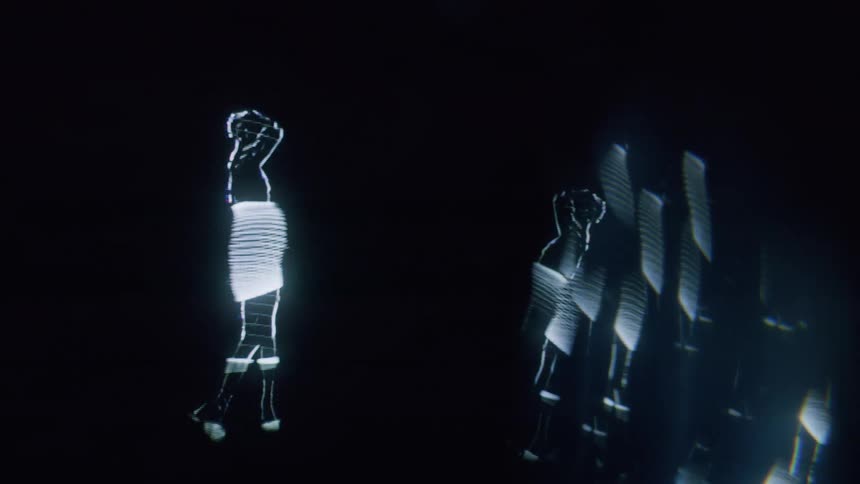 A hologram is of a woman dancing