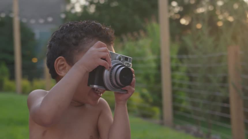 Child playing with a camera