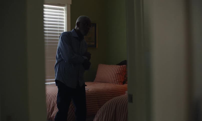 Man adjusting the clothes on his back