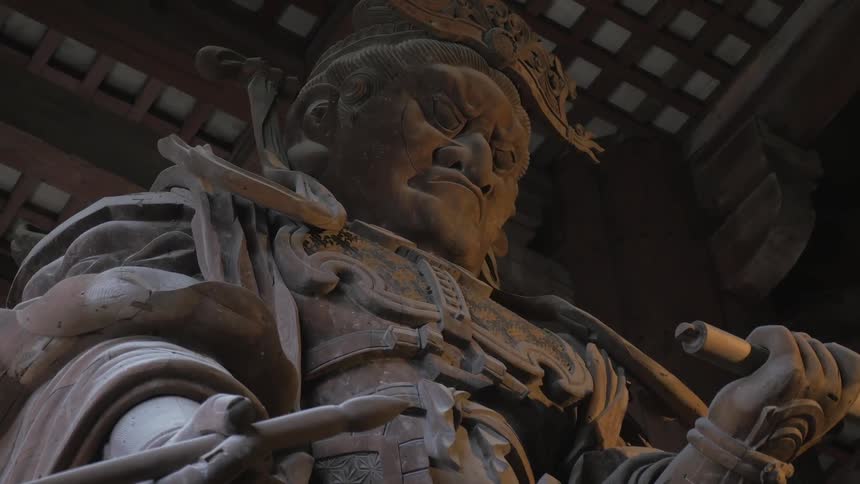 A large statue is holding something